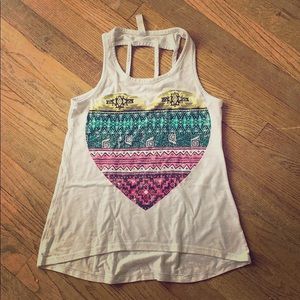 A white tank top with a colorful heart in the mid.